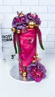 A tall decorated cake made with Frost Form
